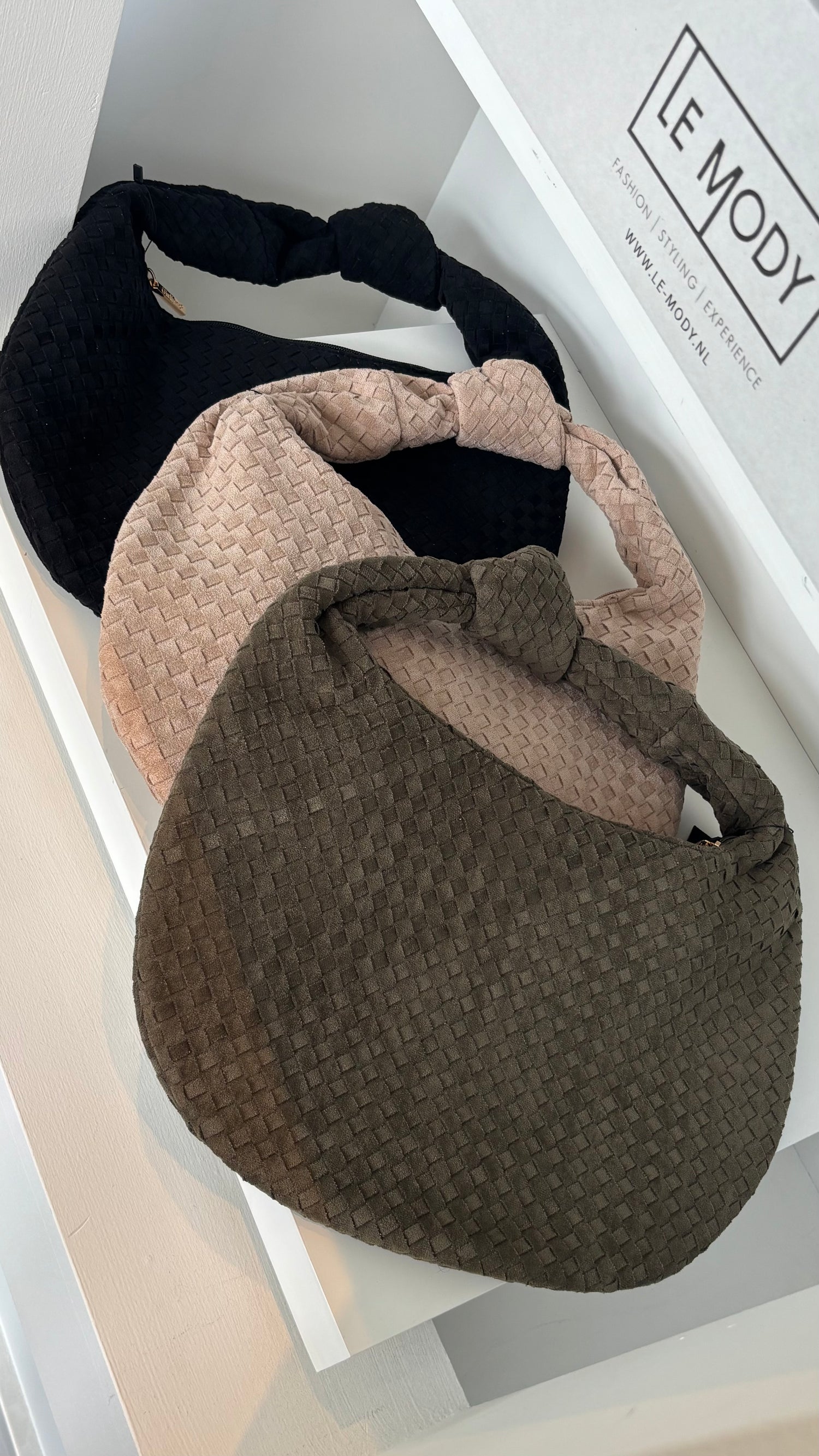 The Signature Row Bag